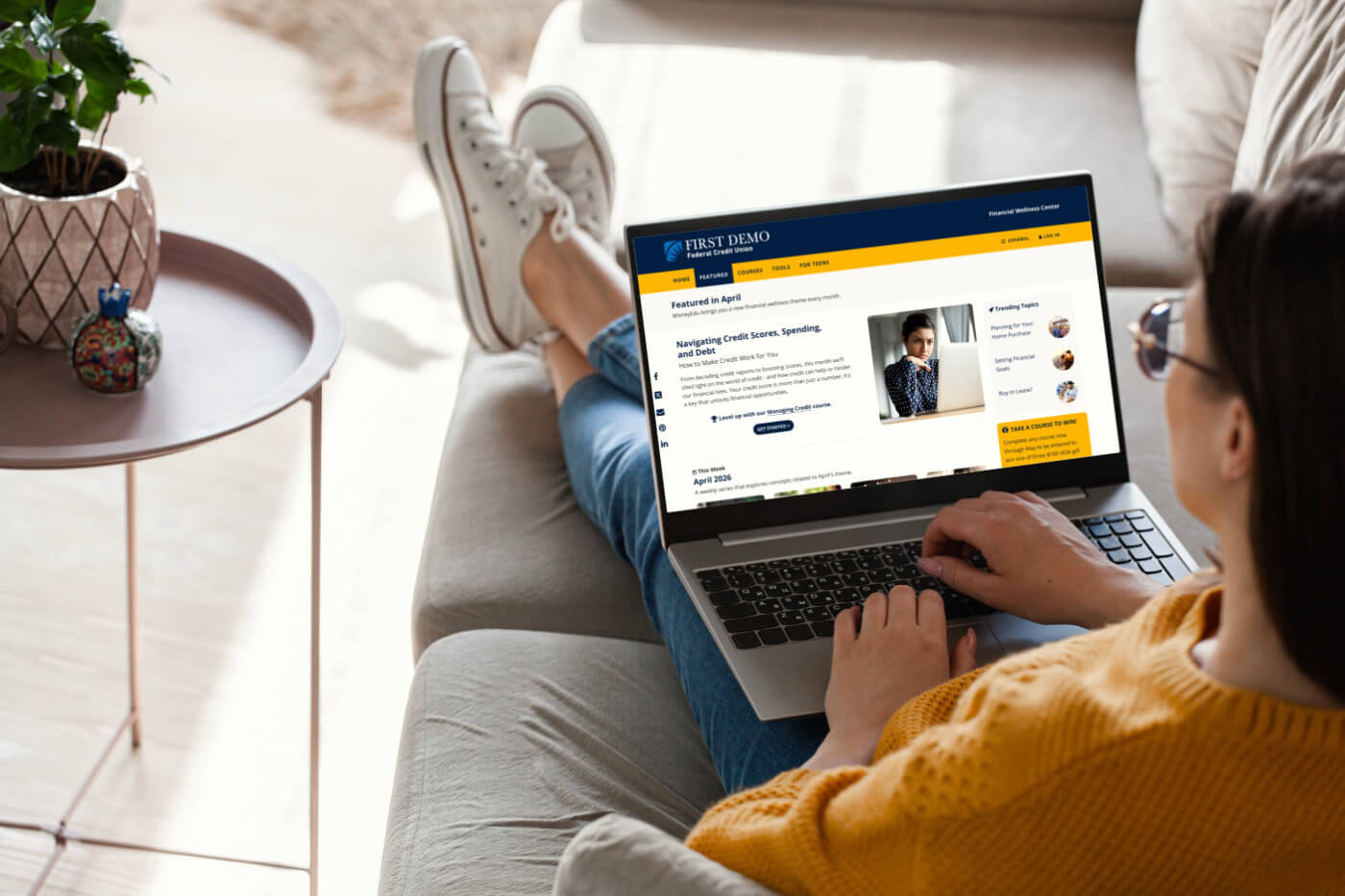 A young person uses the MoneyEdu platform at home