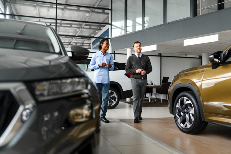A young man shops for a car